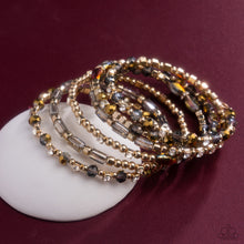 Load image into Gallery viewer, Timeless Tango - Gold Bracelet - Paparazzi Jewelry
